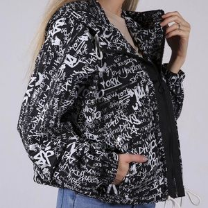 Brand new  dkny graffiti rain jacket — black/white